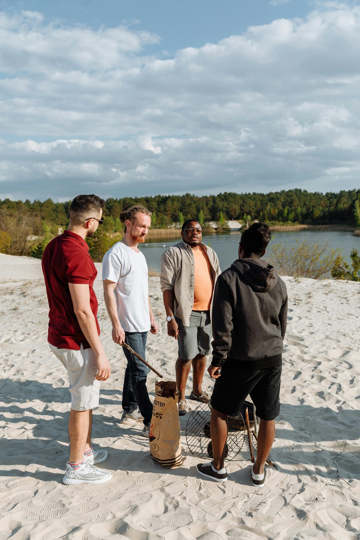 Group of men gathered outdoors during a community outing