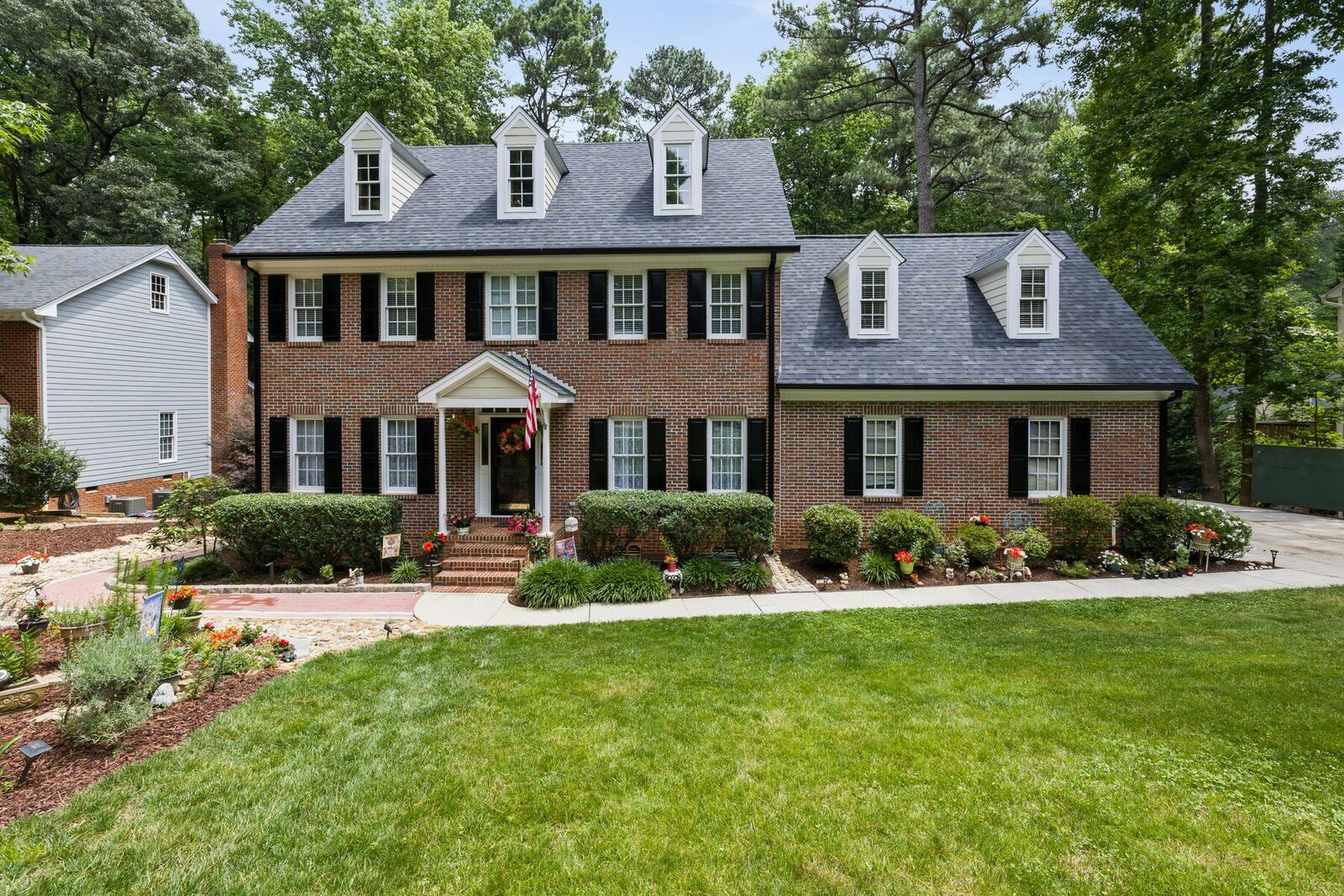 Exterior of Germantown Sober Living Home, a brick colonial in the Milestone area of Germantown Maryland