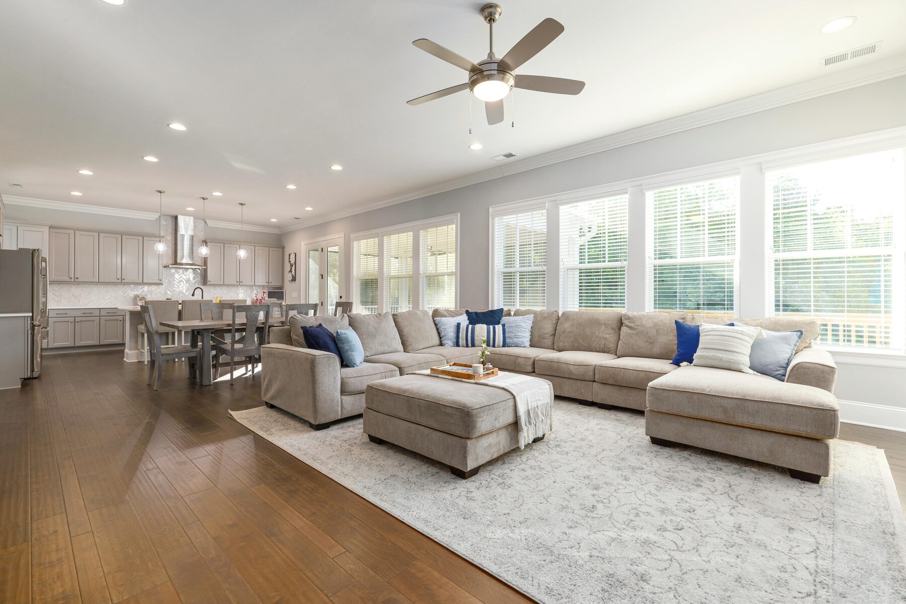 Open concept living room and kitchen with modern furnishings at Germantown Sober Living Home
