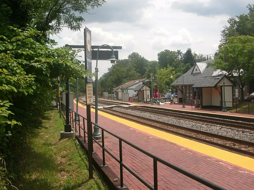The historic Germantown MARC train station in Maryland with brick platform and small station building